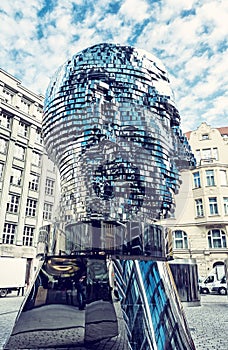 Moving statue of Franz Kafka in Prague, blue filter